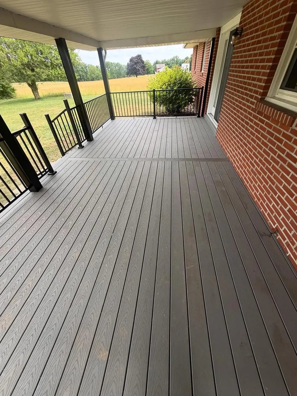 New composite deck with black aluminum railing in Buffalo, NY