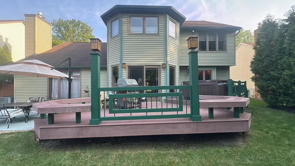 Wraparound composite deck with curved bench seating in Buffalo, NY