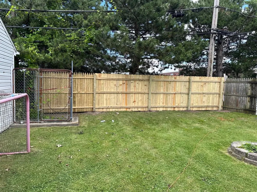 New wood privacy fence enclosing a backyard in Buffalo, NY