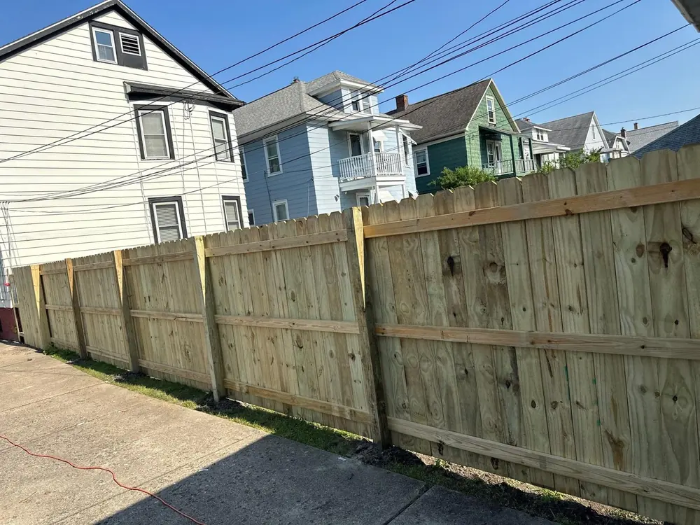New white vinyl porch railing on a front stoop in Buffalo, NY