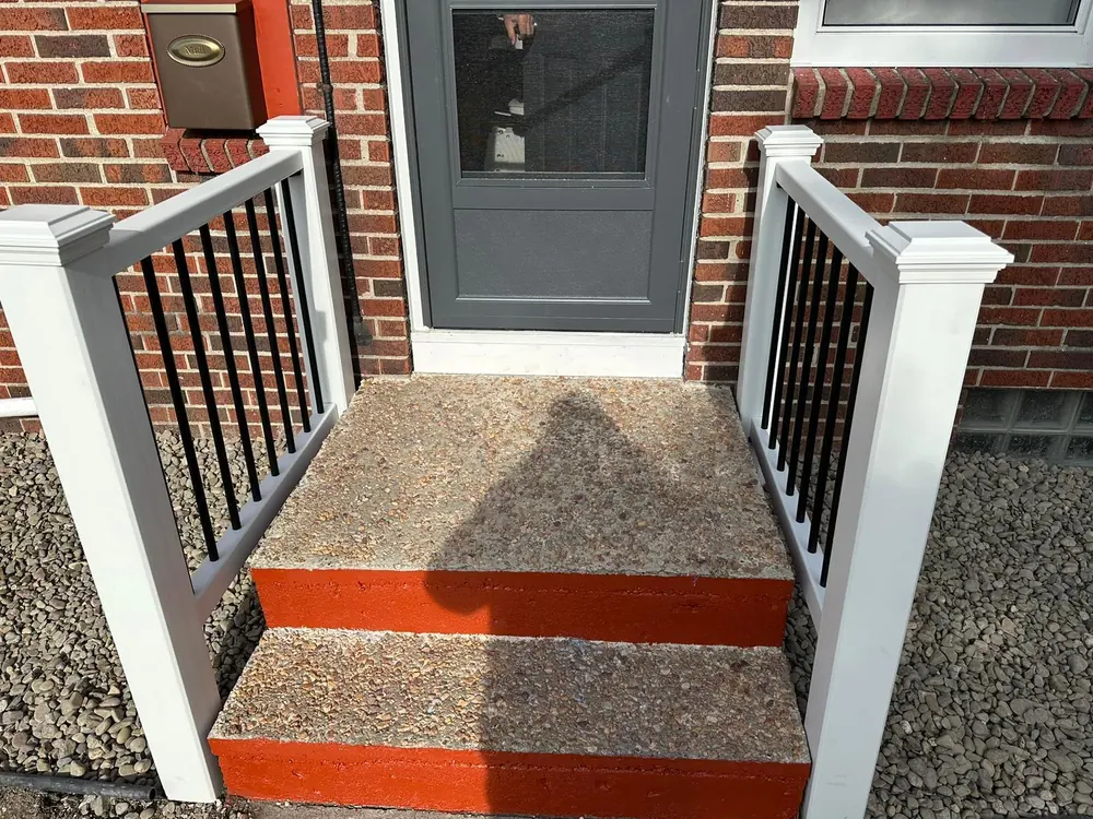 Front porch steps with new railing in Buffalo, NY