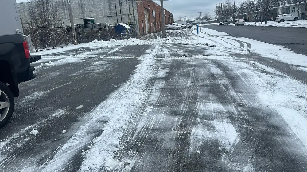 Commercial lot cleared to pavement after a storm in Buffalo, NY