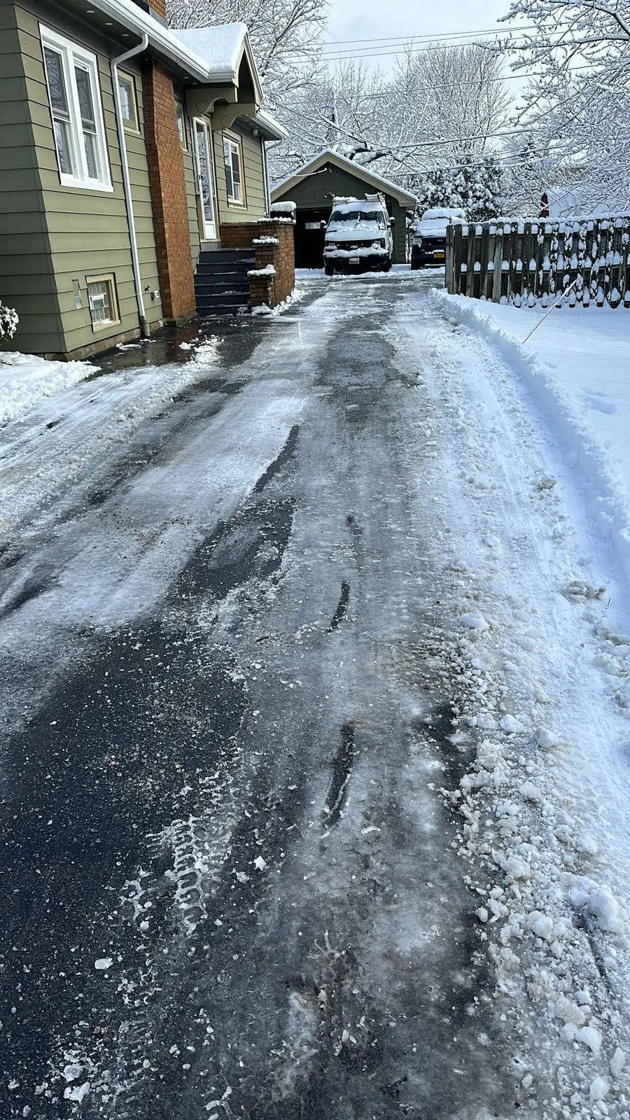 Cleared alley walkway between deep snowbanks in Buffalo, NY